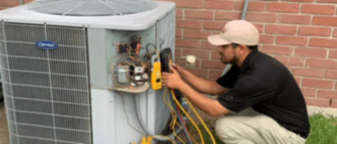 Katy Plumbing HVAC technician servicing a residential air conditioning system
