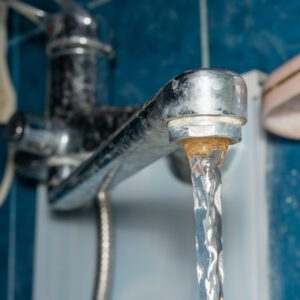 Hard Water building up on a bathroom faucet.